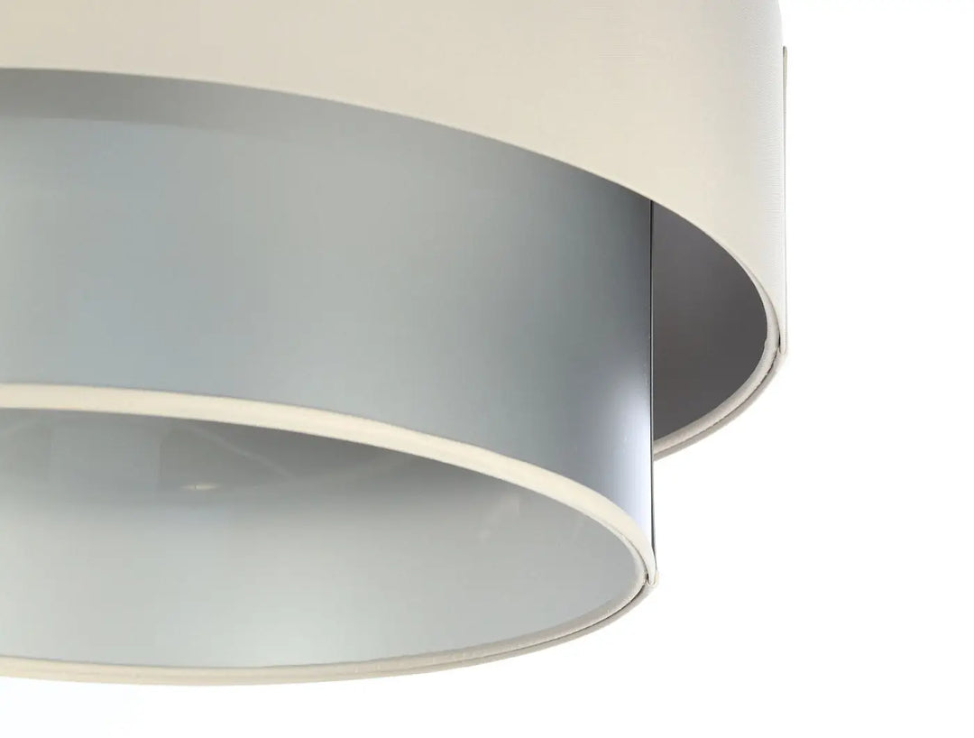 Suspension luminaire duo avec abat-jour circulaires concentriques en crème et argent mat moderne et épuré