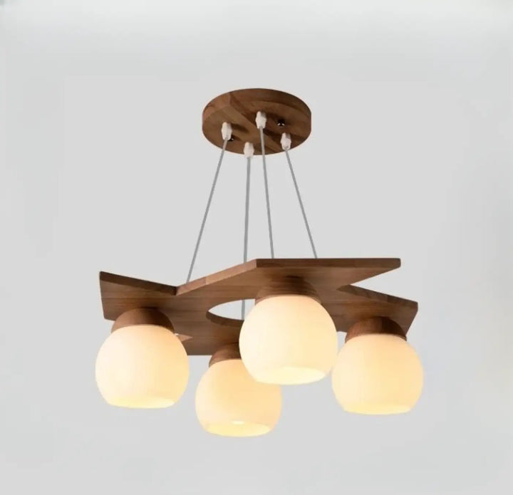 Suspension luminaire moderne en bois avec quatre globes en verre dépoli suspendus par des cordons métalliques fins