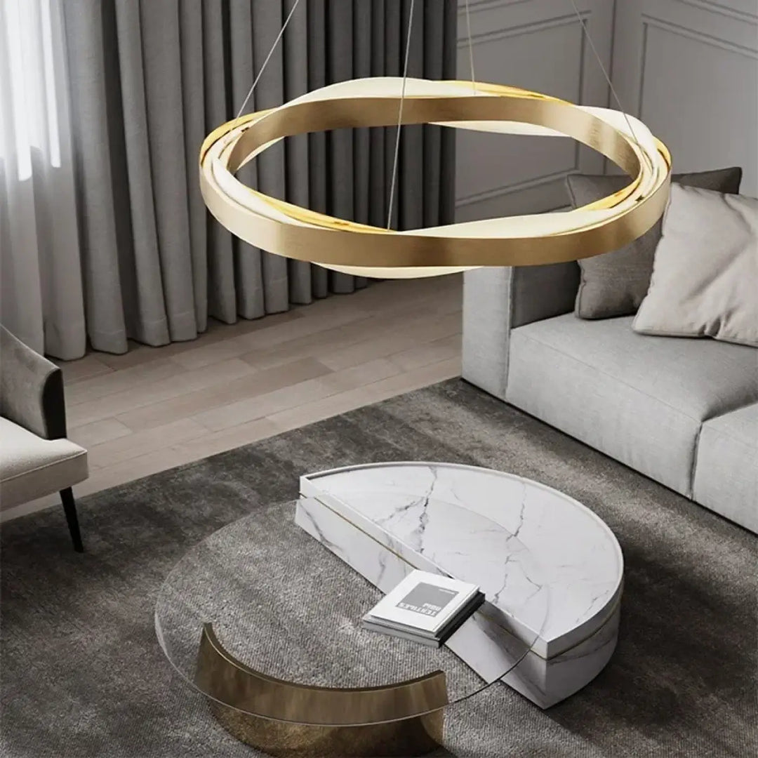 Suspension luminaire alianza en métal doré avec design chic circulaire moderne au-dessus dune table basse
