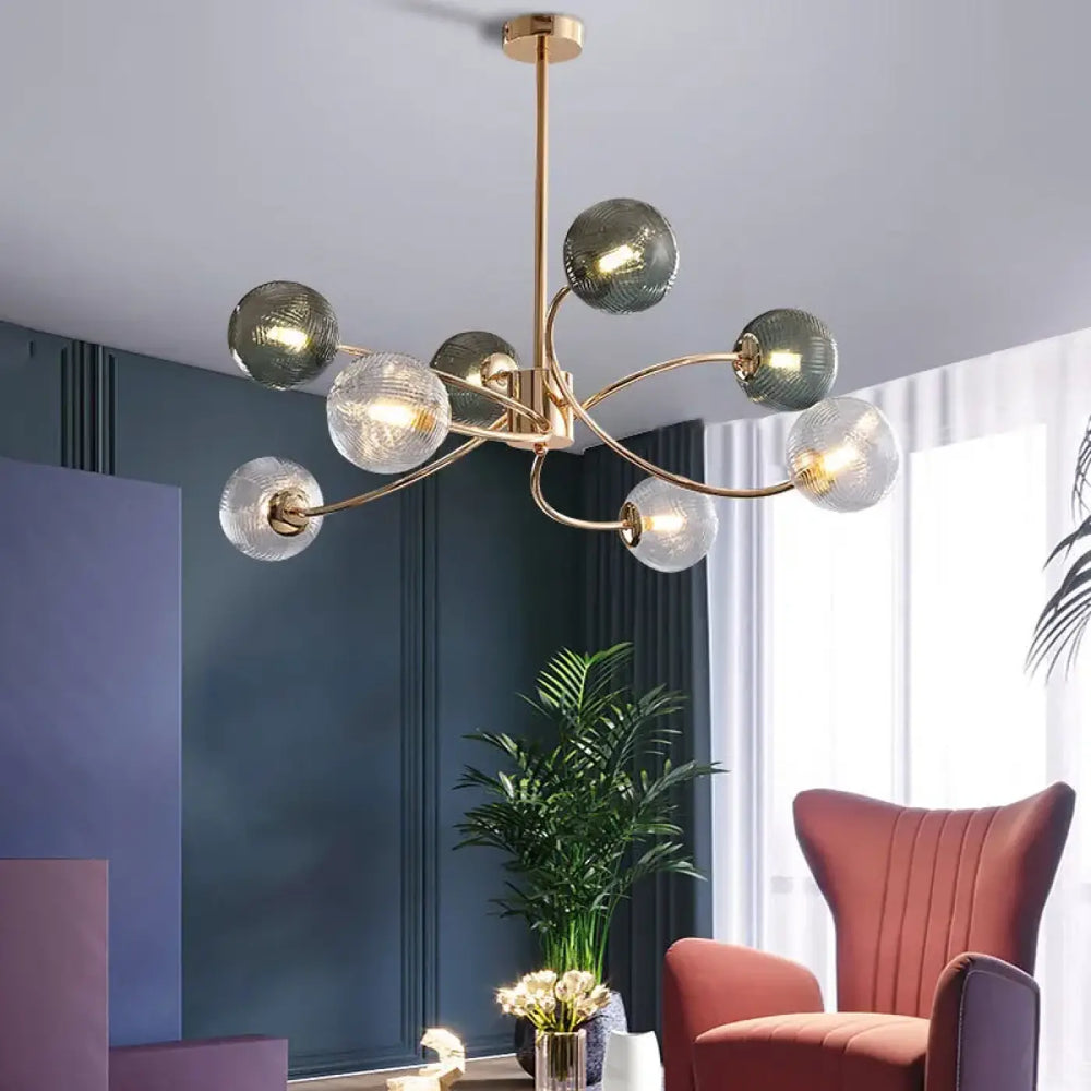 Suspension luminaire norse en laiton avec globes en verre clair et vert fumé design contemporain