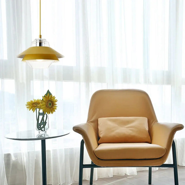 Tan leather armchair with black metal frame and cushion in a suspension luminaire design for décoration intérieure