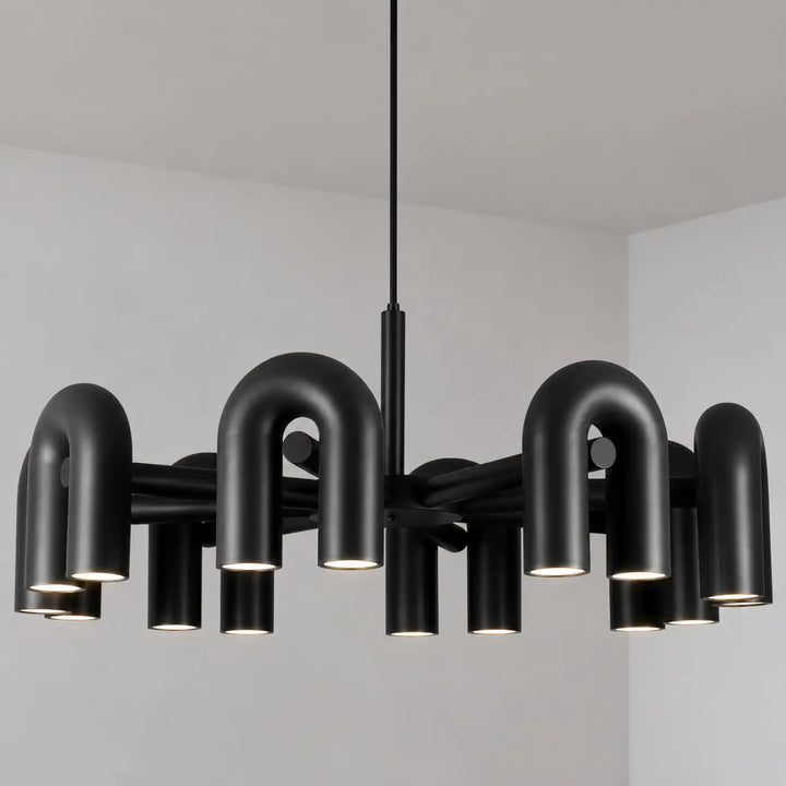 Suspension luminaire ura en finition mate noire avec bras courbés et spots cylindriques design moderne