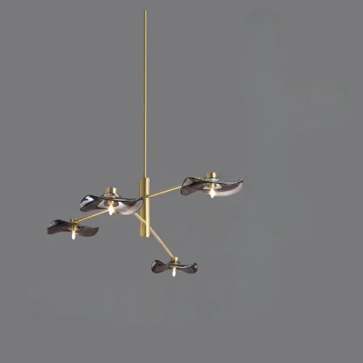 Suspension luminaire vetros en laiton finition moderne avec quatre abat-jours en verre fumé foncé sculptural
