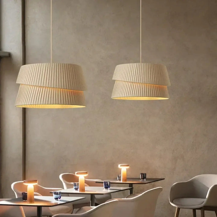 Beige suspension luminaire with pleated design and warm diffused light for elegant lampes suspendues lighting