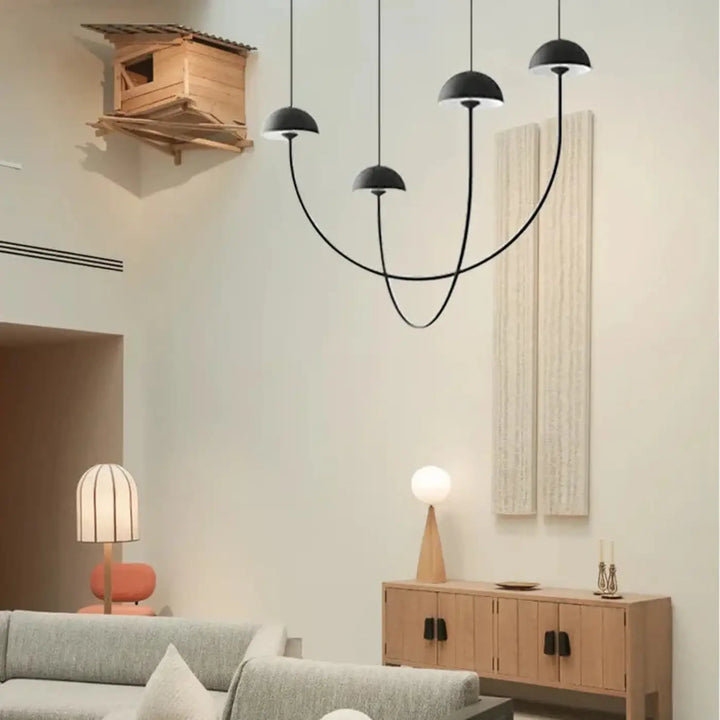 Suspension luminaire rotulia design noire aux bras métalliques courbés et dôme noir pour éclairage intérieur