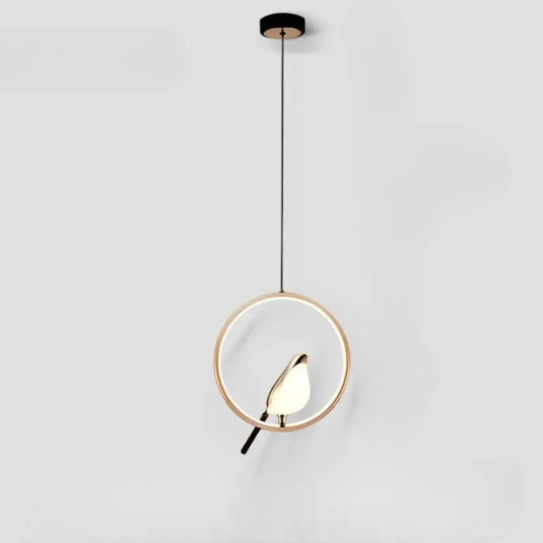 Suspension luminaire fody avec halo lumineux et cadre doré minimaliste et silhouette d oiseau illuminée au centre