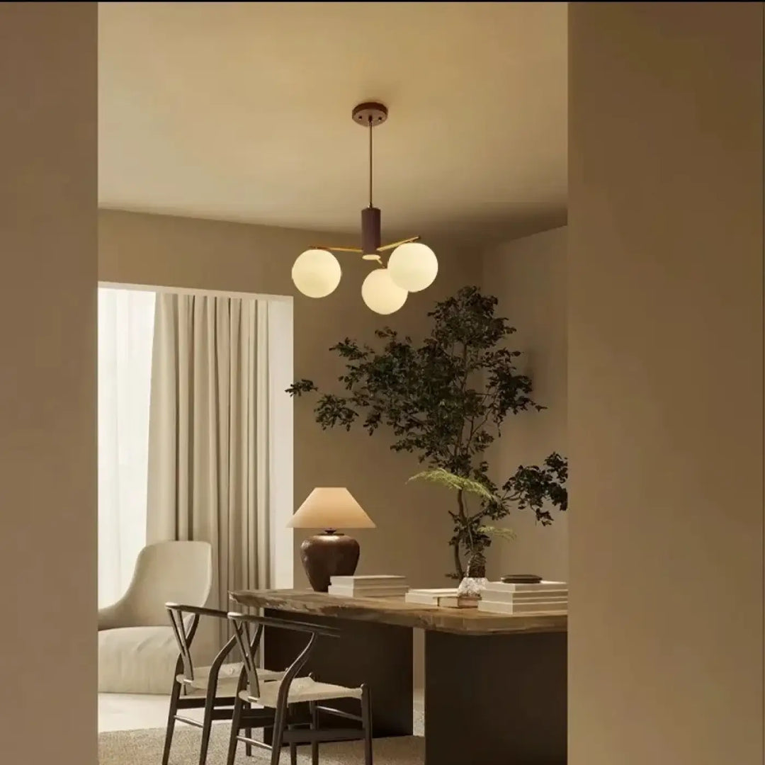 Suspension luminaire juglys avec trois sphères lumineuses en verre givré et finition bronze foncé moderne minimaliste