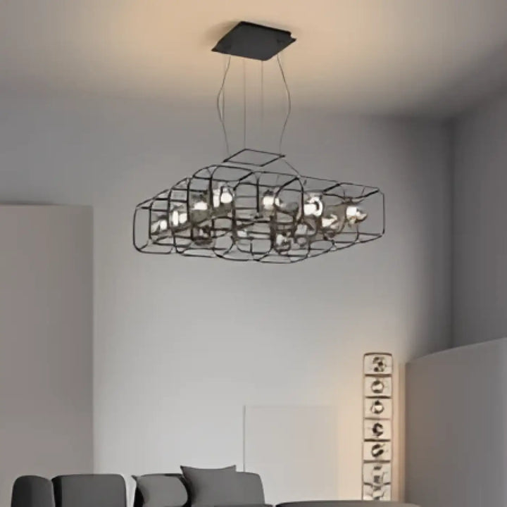 Suspension luminaire nexora en métal noir avec design cage géométrique et plusieurs ampoules apparentes