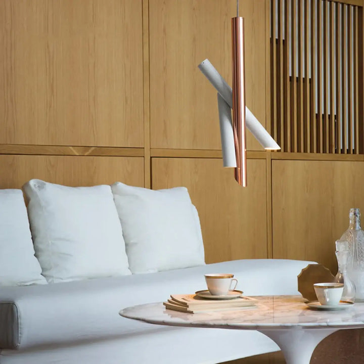 Suspension luminaire konto design tubes croisés avec finition cuivre et blanc en forme cylindrique moderne