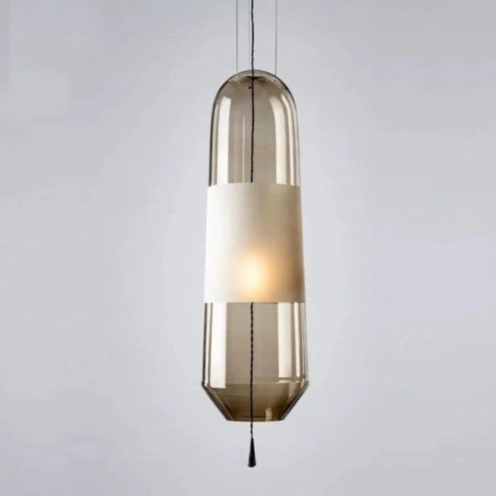 Suspension luminaire oxyA cylindrique en verre ambré translucide avec bande blanche centrale élégante