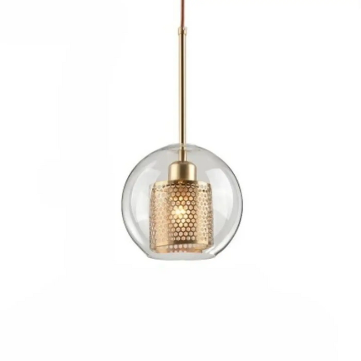 Suspension luminaire zelor avec globe en verre clair et abat-jour cylindrique doré perforé design moderne