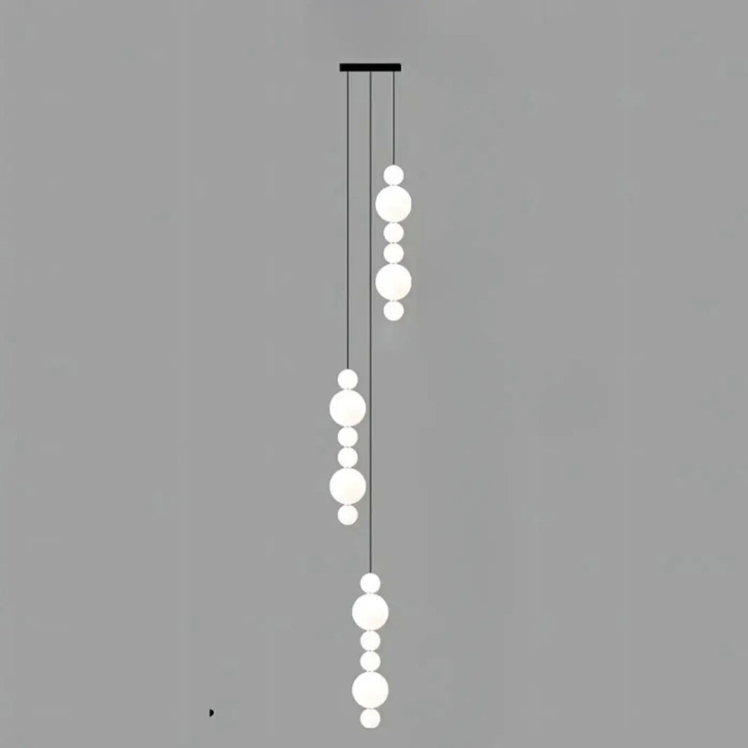 Suspension luminaire oxyo avec boules opalines blanches sphériques et chute verticale noire elegante pour plafond