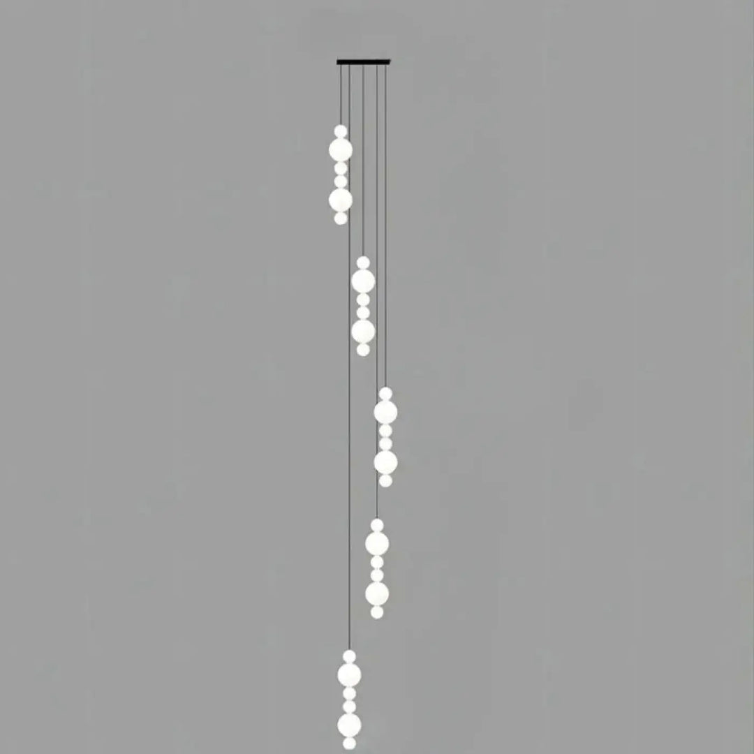 Suspension luminaire oxyo en forme de boule opaline blanche moderne avec cordons noirs minimalistes en chute verticale