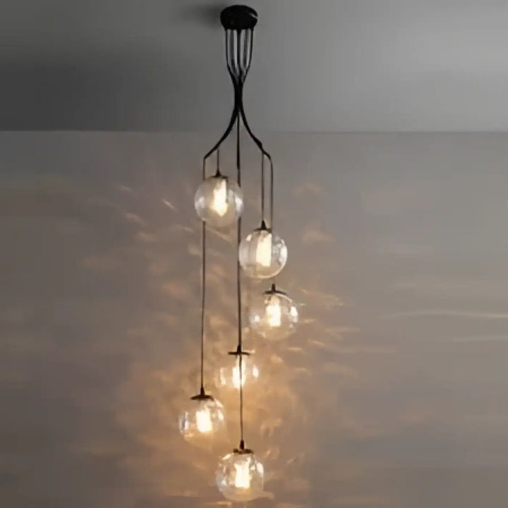 Suspension luminaire umami en métal noir avec plusieurs globes en verre suspendus pour éclairage moderne