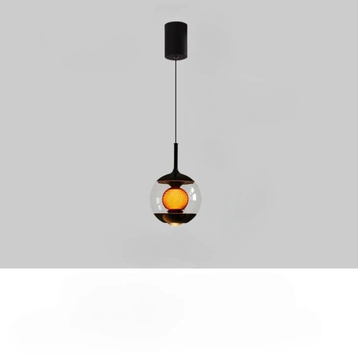 Suspension luminaire nexus avec globe en verre noir et ampoule texturée ambre pour luminosité variable élégante