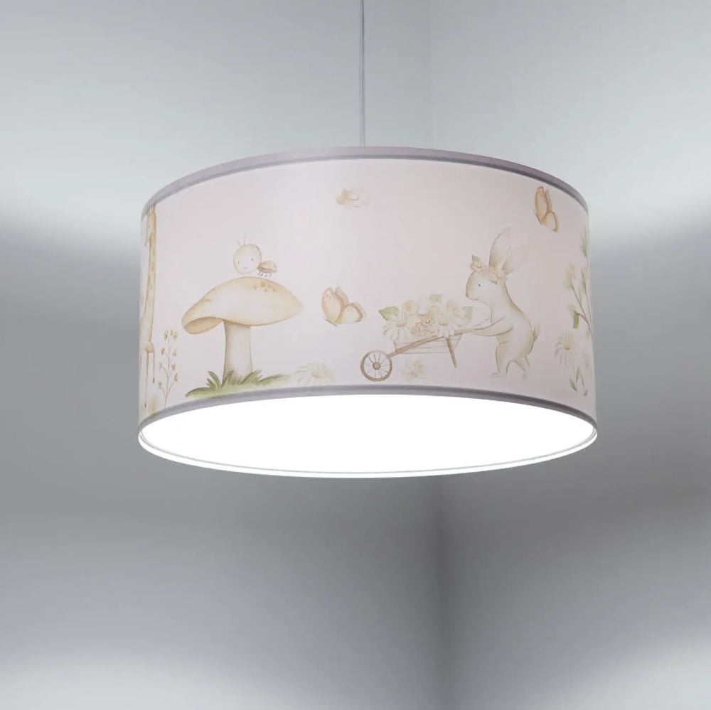 Suspension luminaire enfant cylindrique pastel rose avec illustrations de champignons papillons et lapin en bois blanc marron clair