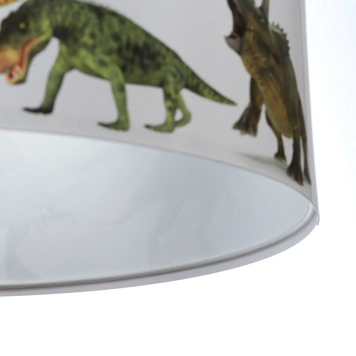 Suspension luminaire enfant avec abat-jour cylindrique blanc orné de dinosaures verts et bruns pour luminaire enfant dinosaure