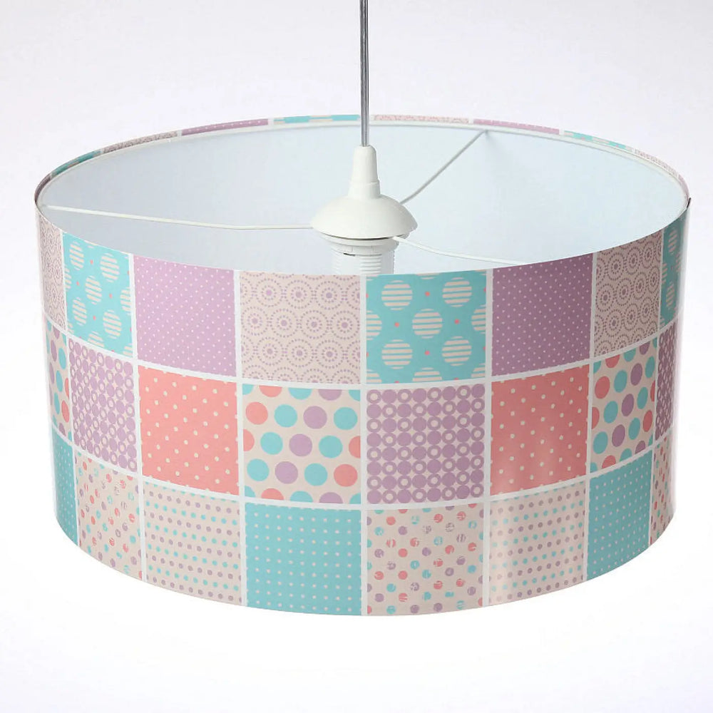 Pastel-colored patchwork suspension luminaire enfant with polka dots and geometric patterns in soft pinks blues and purples