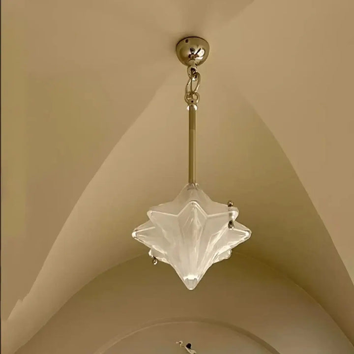 Suspension luminaire vinty en verre transparent étoilé avec chaîne et fixation au plafond finition laiton pour éclairage doux