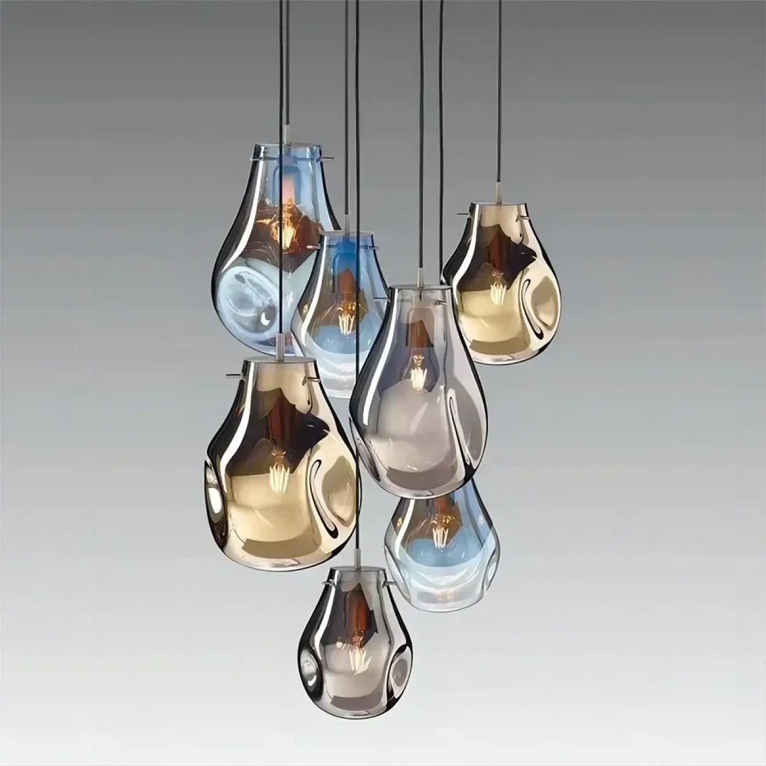 Suspension luminaire vulco avec sept abat-jours en verre en forme de goutte, finitions métalliques, bleu translucide et or