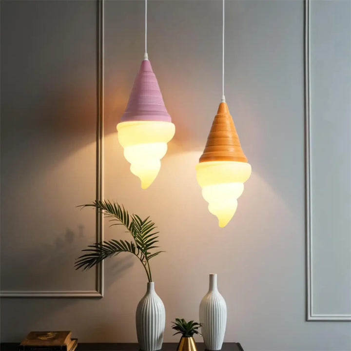 Two pastel-colored suspension luminaires glace italienne with textured surface and warm glow from gelato collection