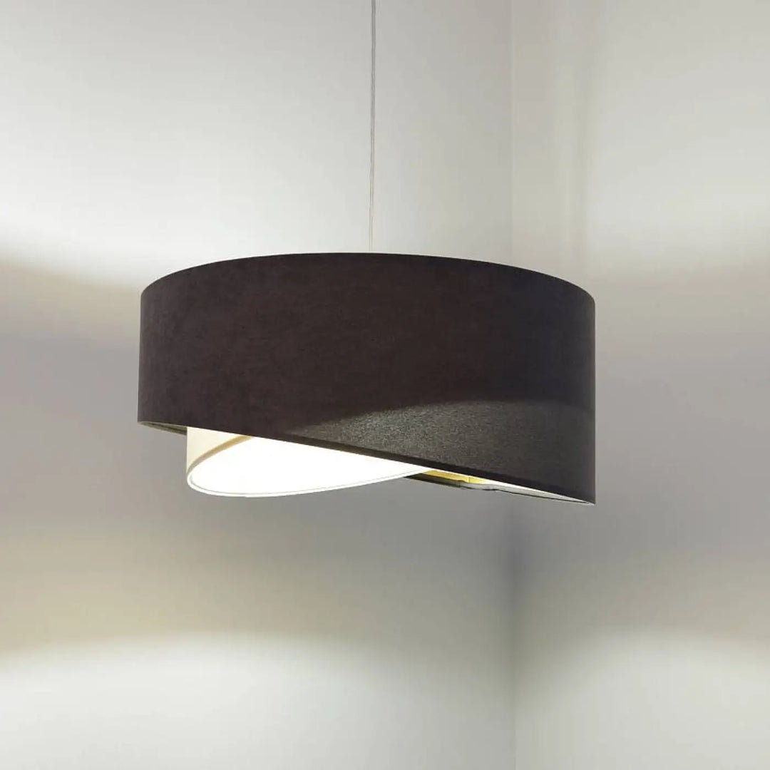Suspension luminaire graphite galaxy auric en velours style chic avec lumière cylindrique diffuse noire et texture subtile