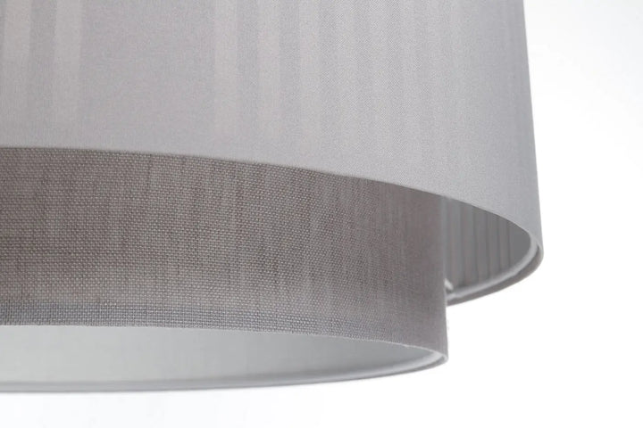 Suspension luminaire grise duo lami line avec abat-jour cylindrique en tissu gris et plis verticaux subtils