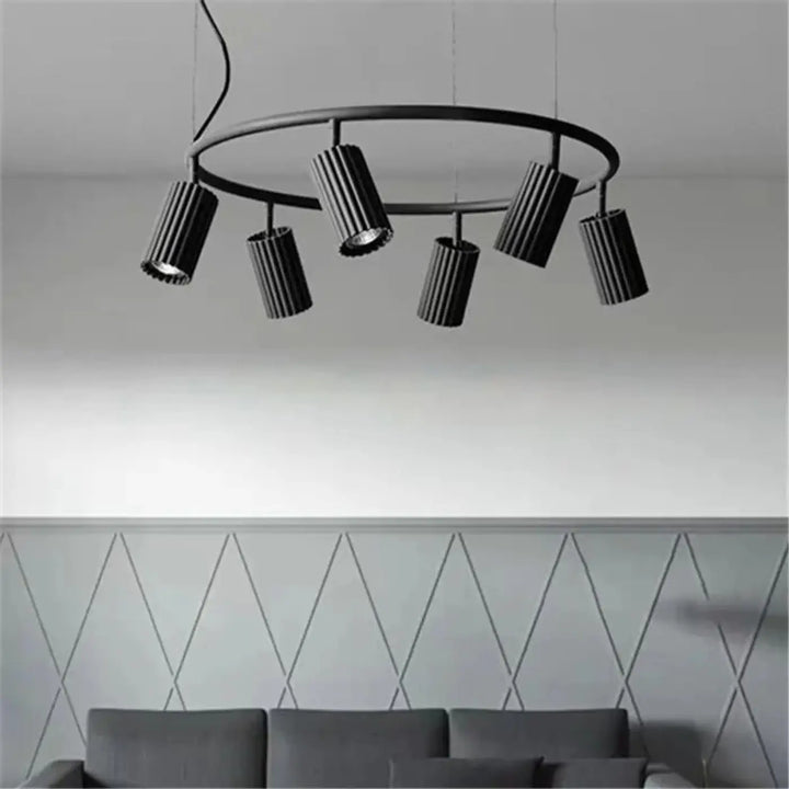 Suspension luminaire zynth noir avec cinq cylindres texturés pour un éclairage minimaliste et design