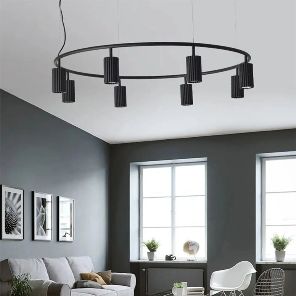Suspension luminaire minimaliste zynth avec cylindres texturés noirs et abat-jour circulaire en suspension