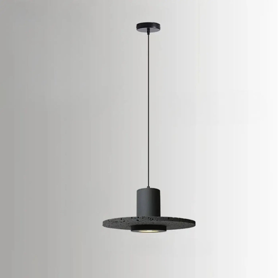 Suspension luminaire danys noire moderne avec abat-jour cylindrique et base circulaire texturée pour salle à manger pierre trou noir