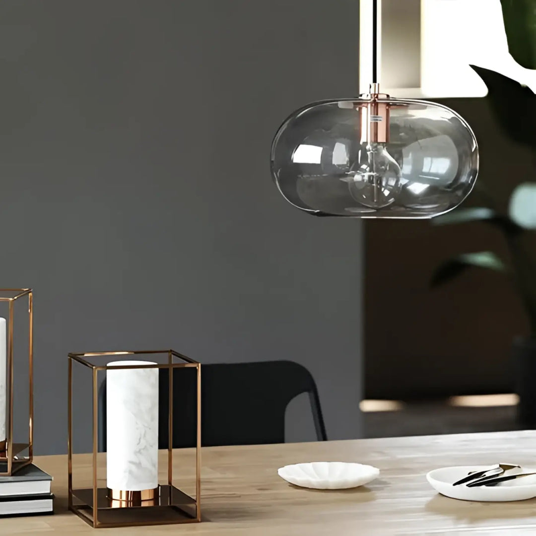 Suspension luminaire moderne sietra en verre fumé gris avec accents métalliques en rose gold élégant et contemporain