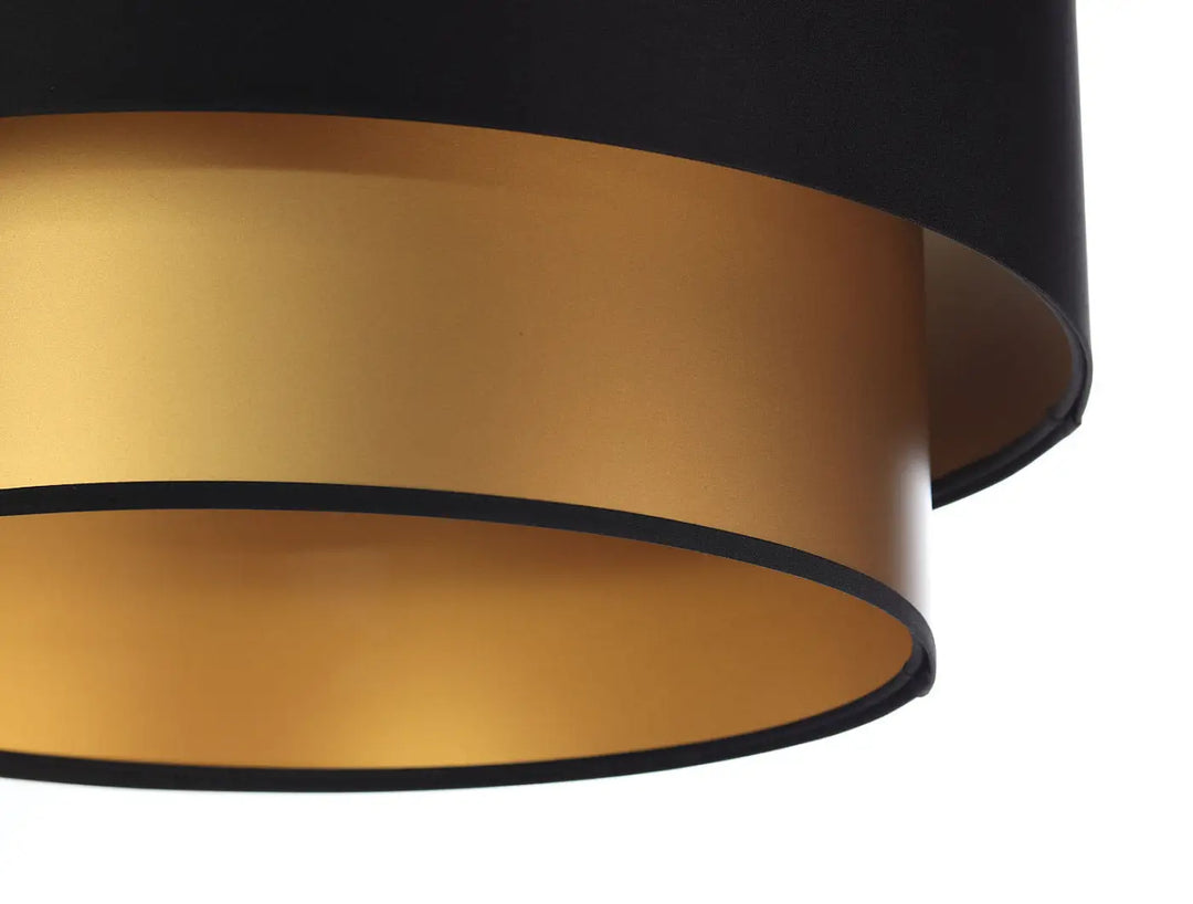 Suspension luminaire noire duo noir doré avec abat-jour tambour deux niveaux en tissu noir mat et doublure métallique