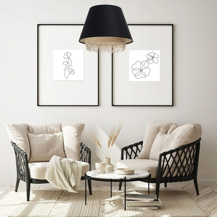 Suspension luminaire noire modern with black woven wicker armchairs beige cushions and black metal coffee table