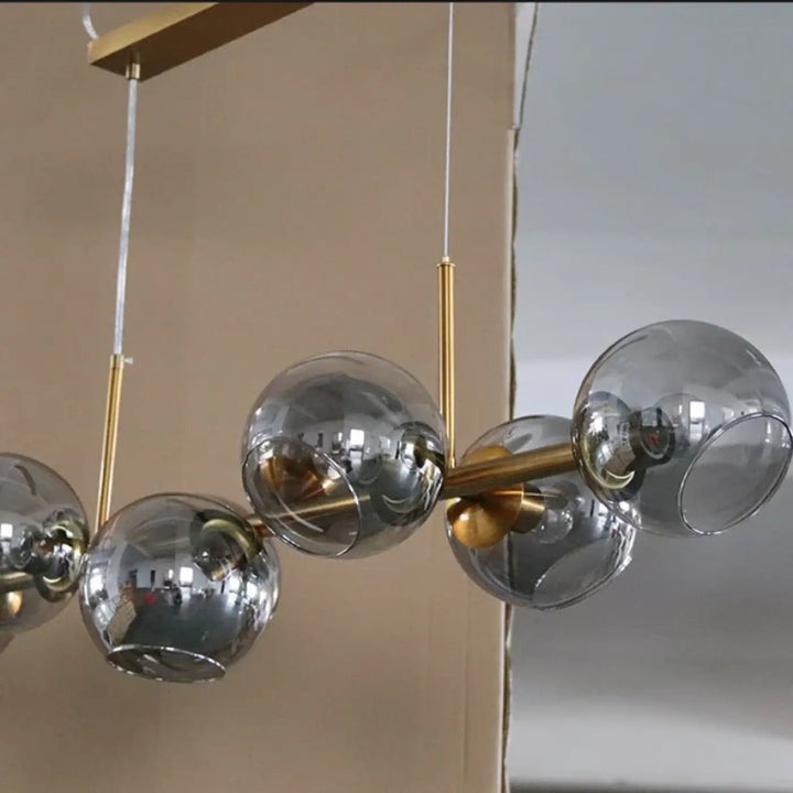 Suspension luminaire style art déco dorée en verre
