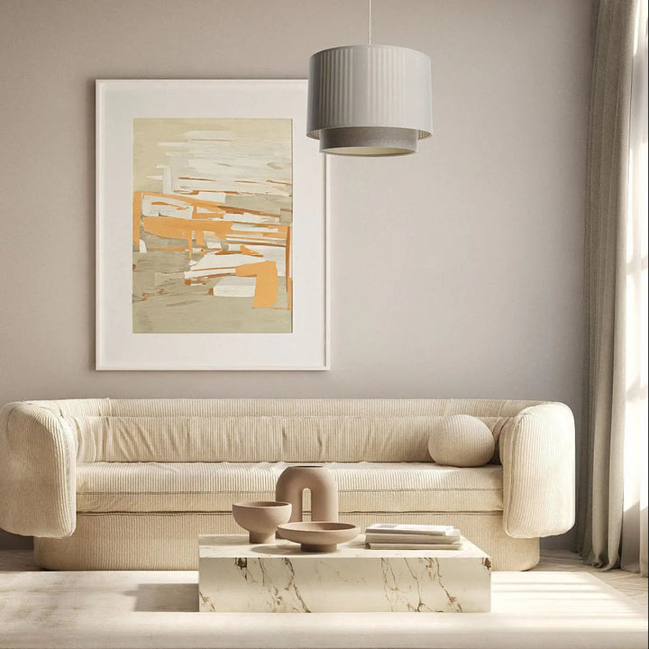 Suspension luminaire duo lami line avec canapé beige en tissu beige à bras arrondis et dossier capitonné style moderne chic