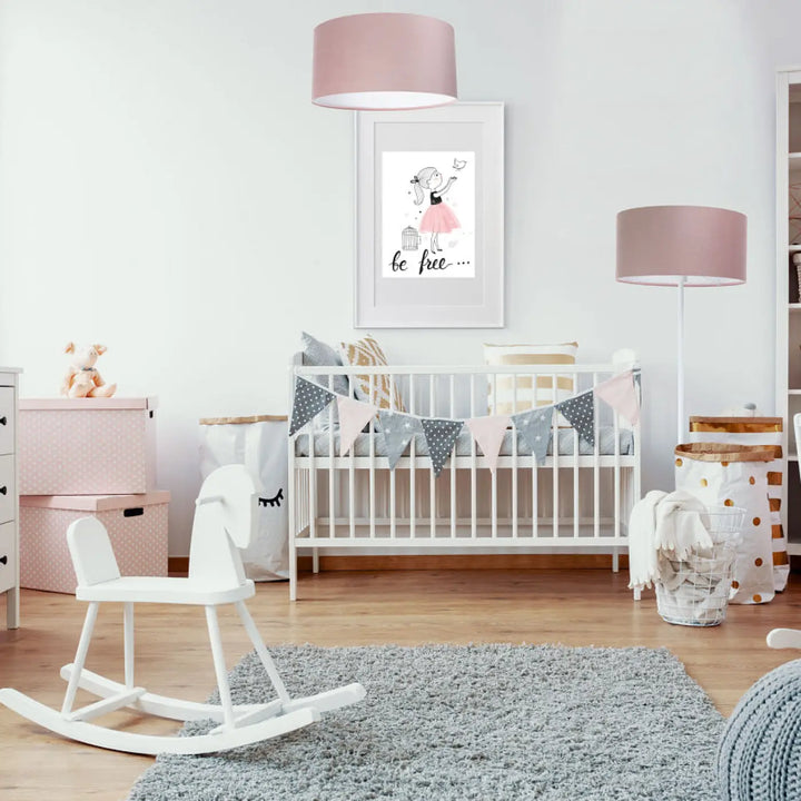 White wooden rocking horse with smooth finish shown alongside classic jasmin suspension luminaire tissu rose design cylindrique