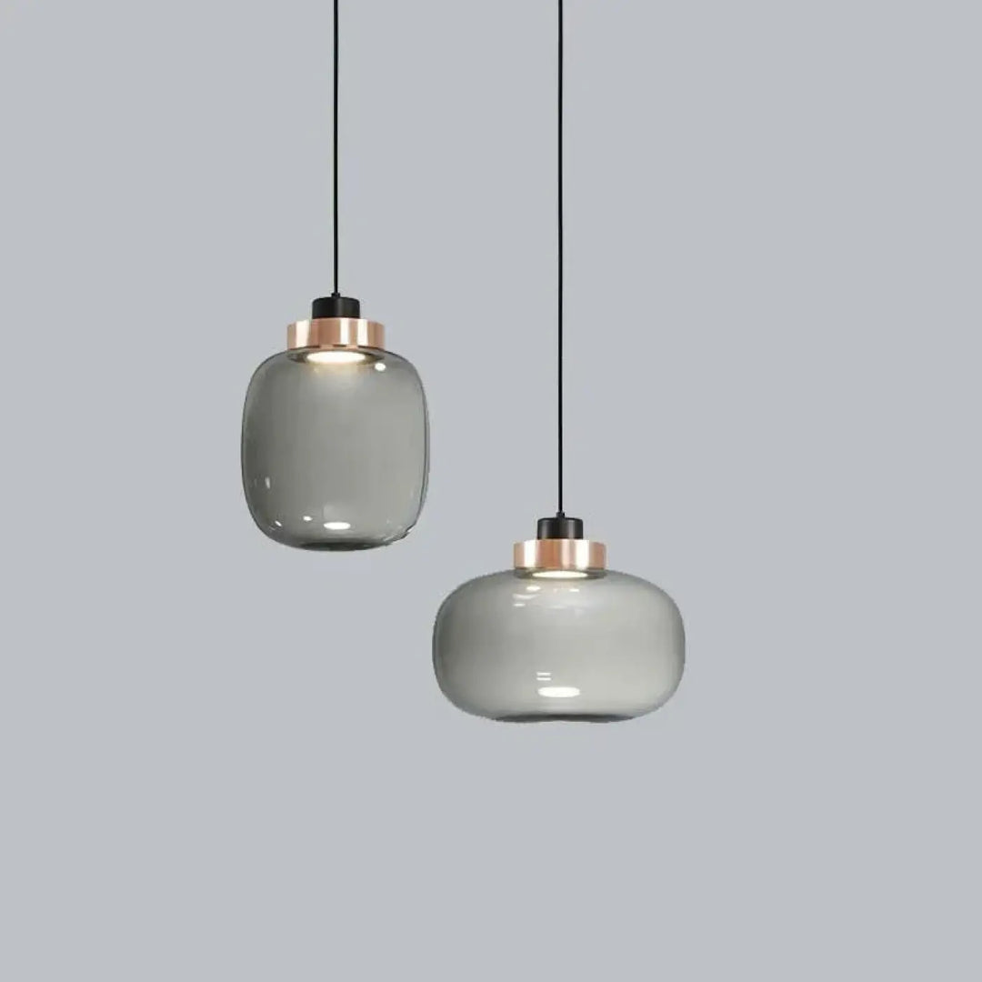 Suspension luminaire mistral avec deux abat-jours en verre gris fumé et accents en rose gold modernes