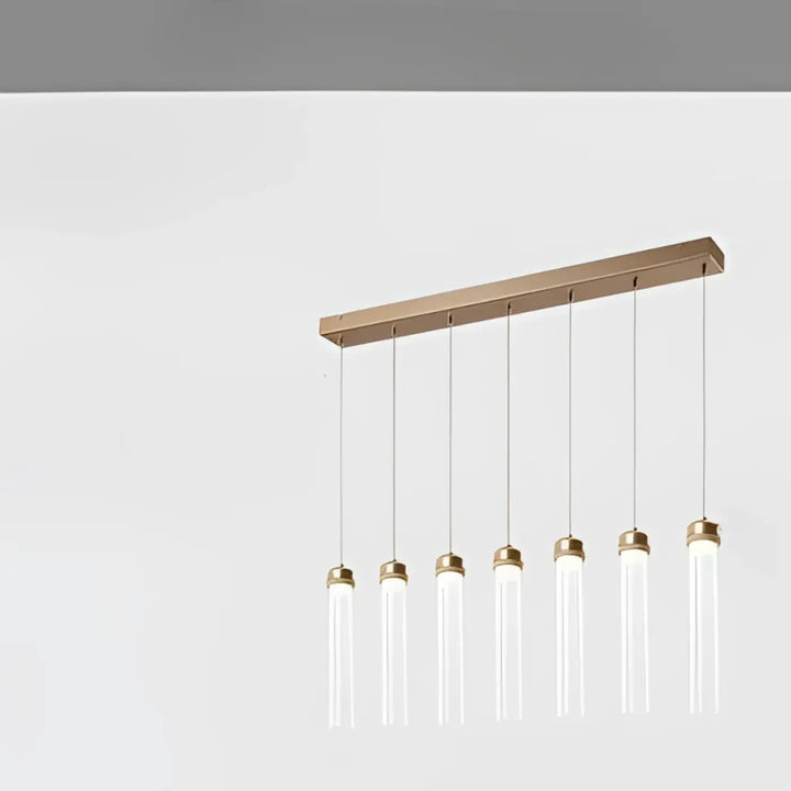 Suspension luminaire modern minimaliste avec six tubes en verre clair suspendus à une barre en bois et caches en laiton brossé
