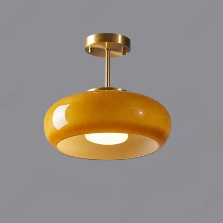 Suspension luminaire melora en verre teinté aux teintes ambres avec monture et tige en laiton finition brillante