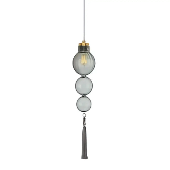 Suspension luminaire medina avec trois sphères en verre teinté empilées et un pampille métallique style chinois