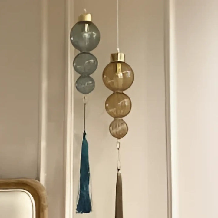 Suspension luminaire medina en verre teinté avec accents métalliques et pampilles style chinois