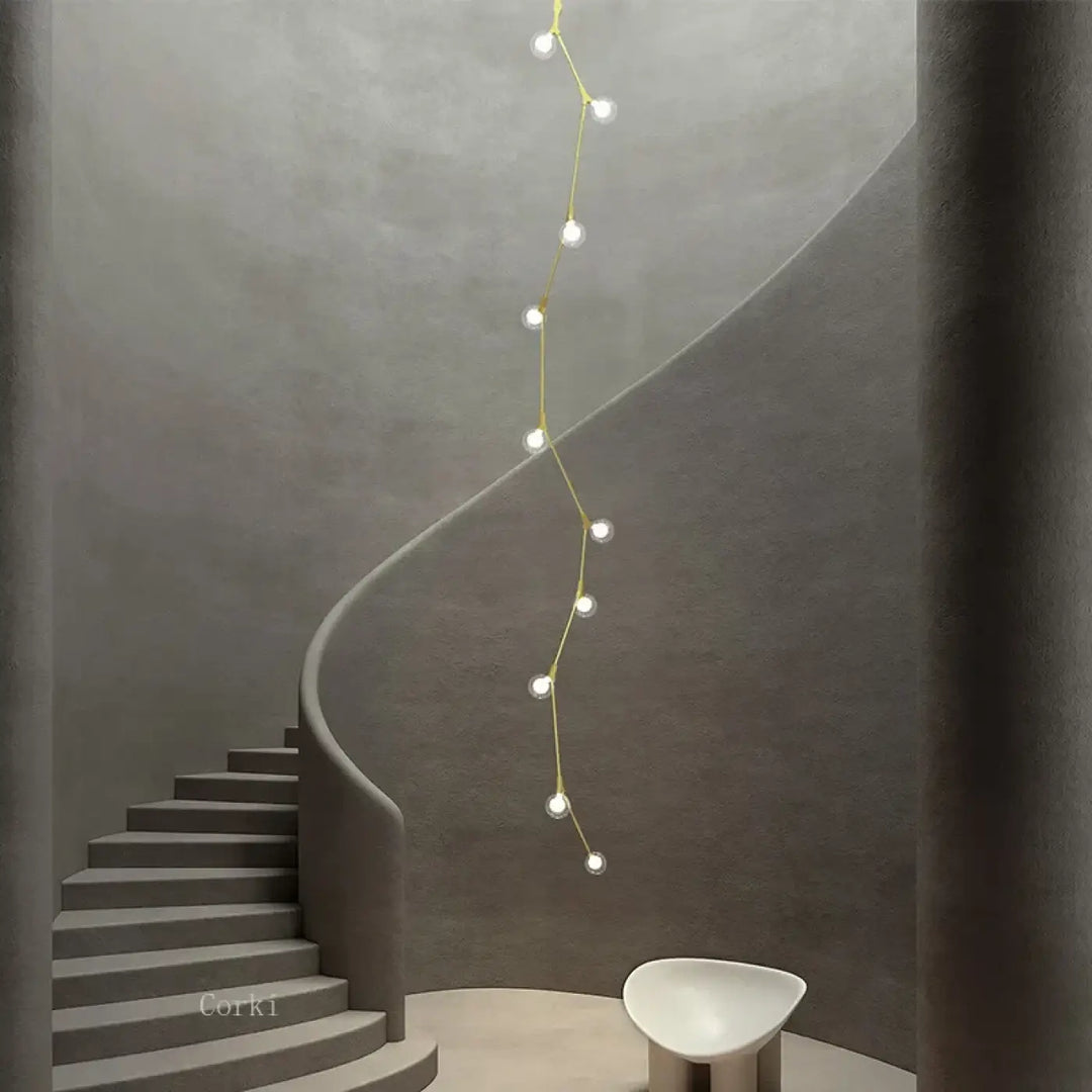 Suspension luminaire verticale en boules opales et laiton