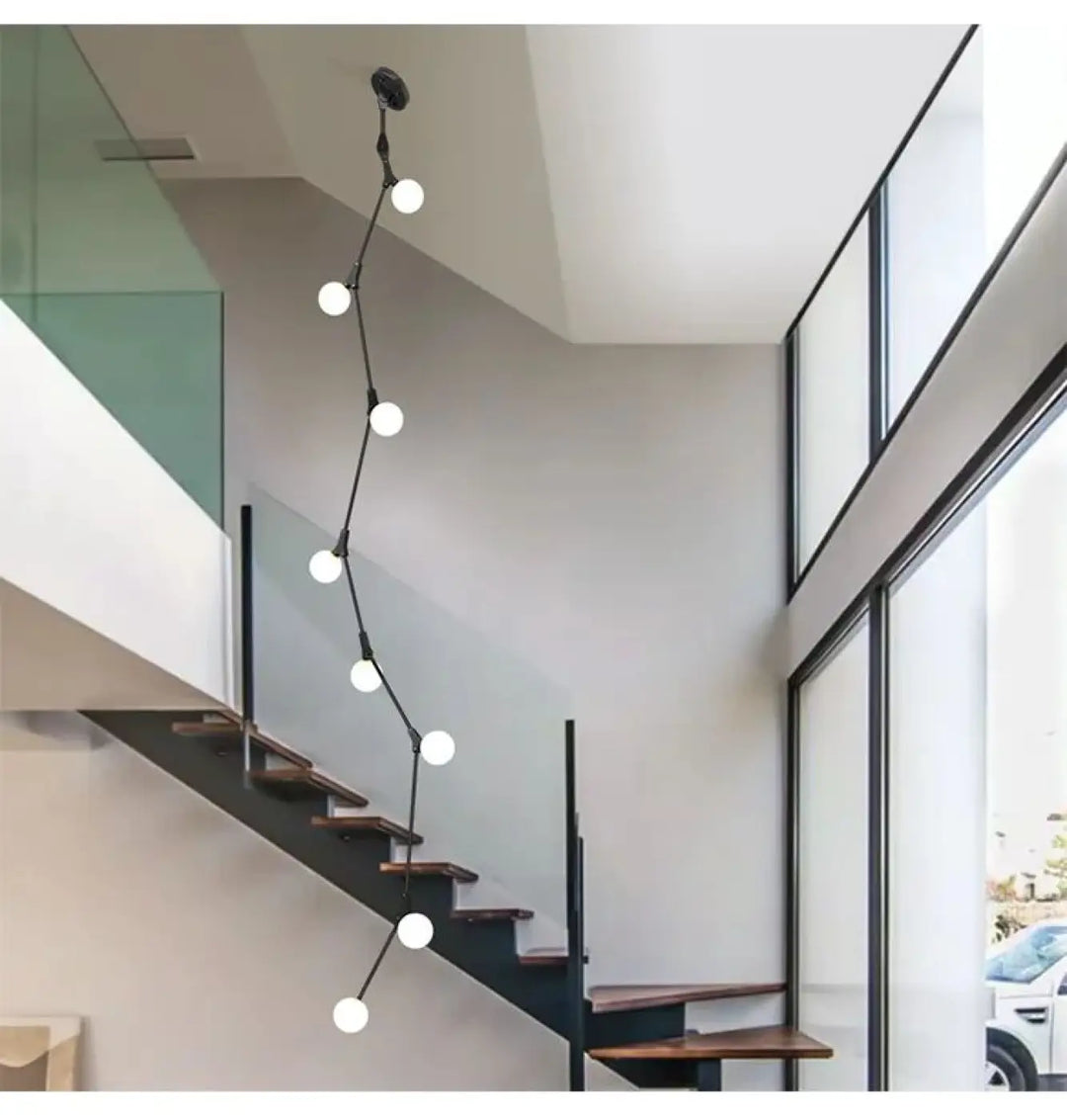 Suspension luminaire verticale en boules opales et laiton