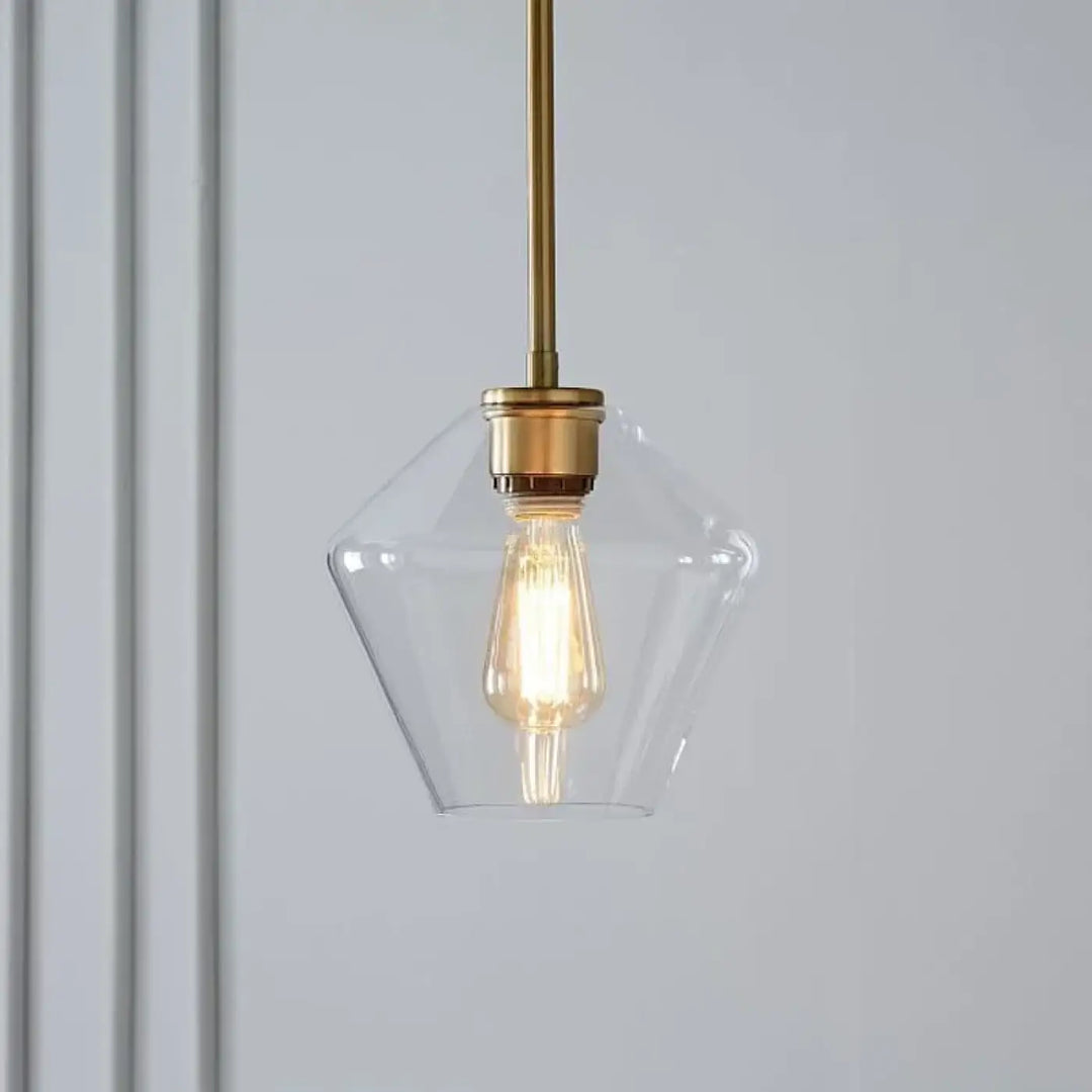 Suspension luminaire glazia en verre transparent avec tige et fixation en métal doré et ampoule edison visible