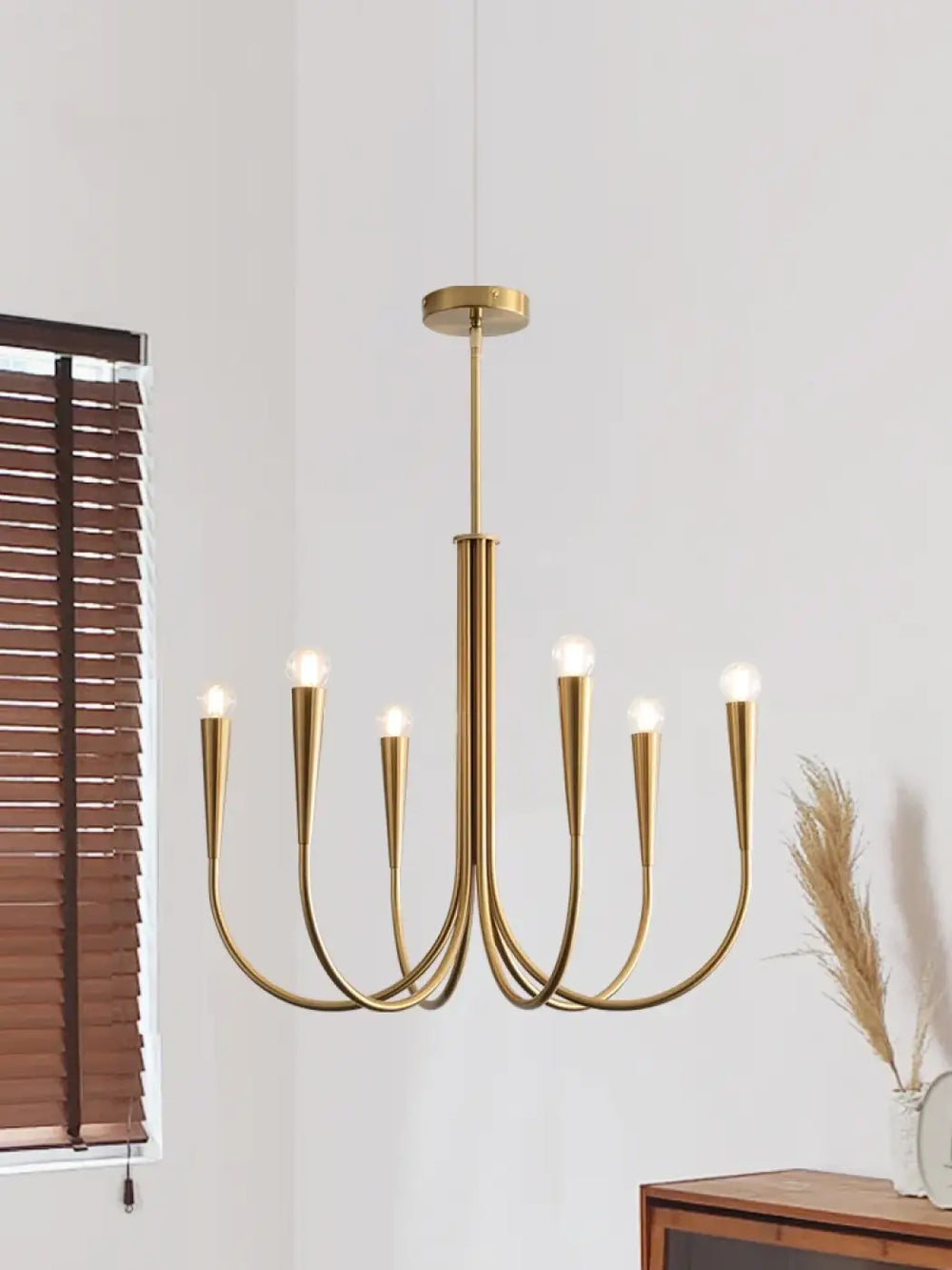 Suspension lustre en métal doré au design chandelier revisité

