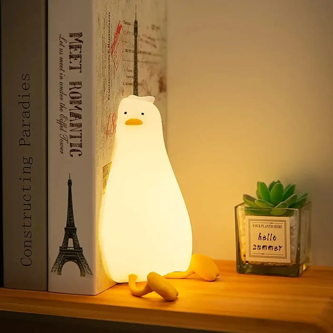 Veilleuse canard douce lumière en forme de canard blanc avec bec et pattes jaunes pour un cocooning craquant