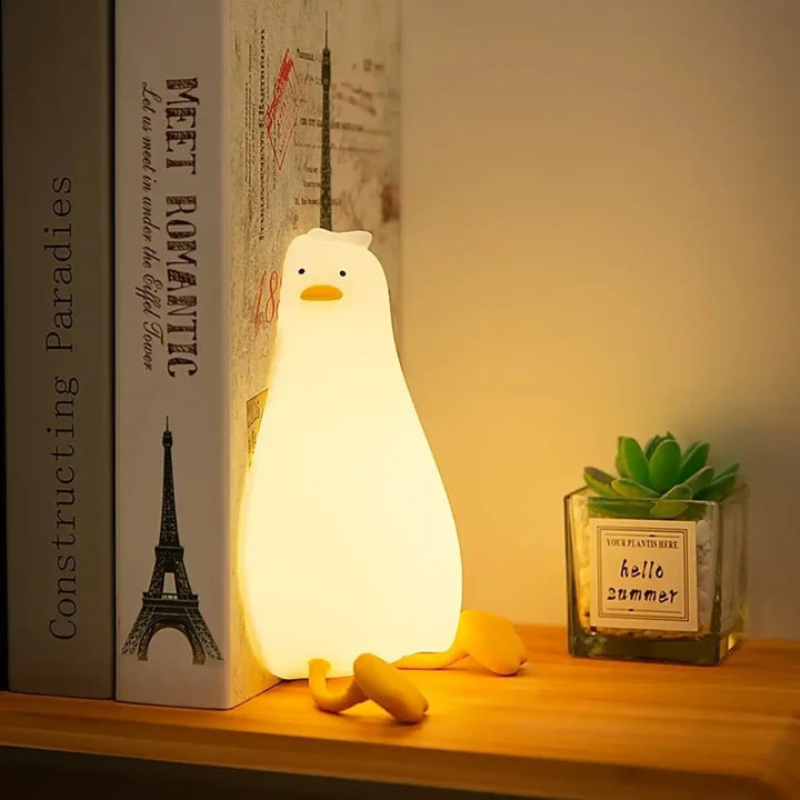 Veilleuse canard douce lumière en forme de canard blanc avec bec et pattes jaunes pour un cocooning craquant