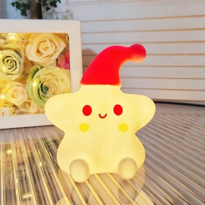 Veilleuse étoile jaune douce en forme d’étoile avec lumière douce et chapeau de père noël c’est offrir un charme unique