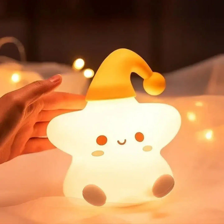 Veilleuse étoile soft glowing with lumière douce and yellow santa hat c’est offrir a cozy nightlight by starsy