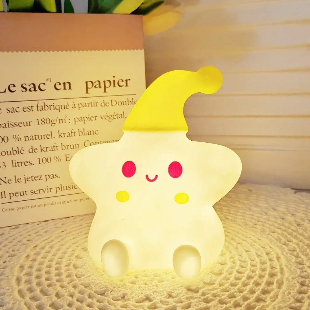 Veilleuse étoile starsy en forme d’étoile jaune douce avec visage souriant et chapeau pointu pour lumière douce et c’est offrir